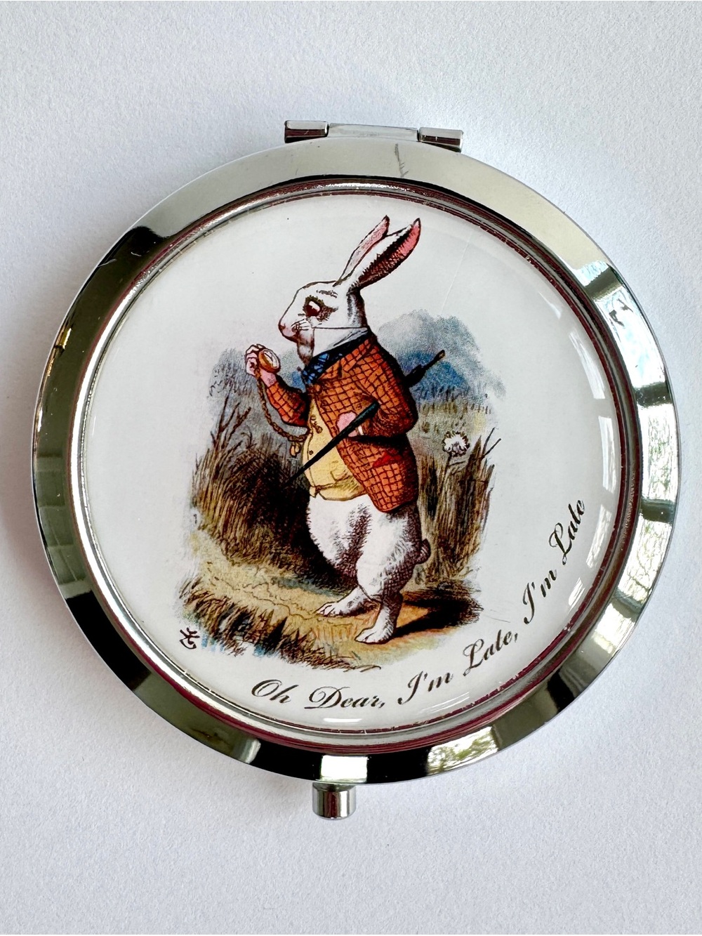 Alice in Wonderland “Rabbit” compact mirror in silver tone finish.